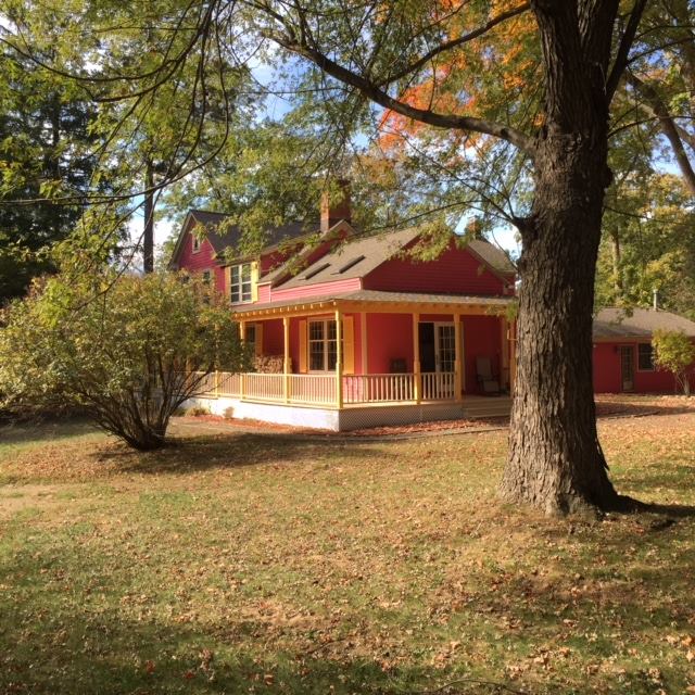 Beautiful Farmhouse Red Siding Wrap Around Patio